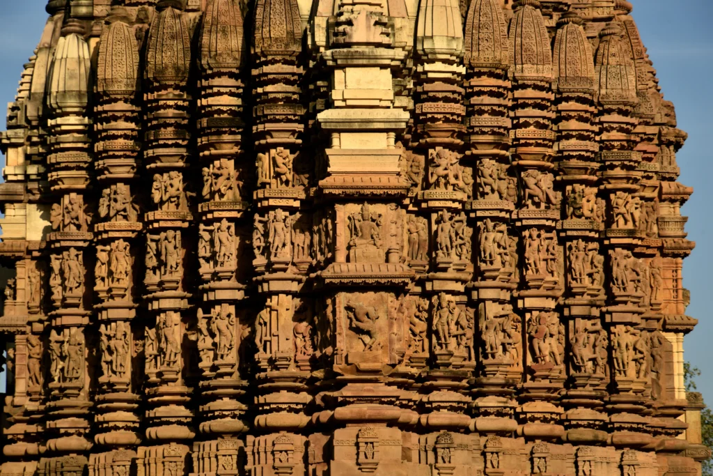 10 Architectural Marvels of Hindu India: A Historian's Journey Through Stone and Spirit 2 Stone carvings on Khajuraho temple walls showing intricate Hindu architectural sculpture from India’s medieval period